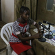 Elisée Nyanokonzo, a 16-year-old pygmy youth reporter, sits inside the recording studio at Radio Mwana, Mbandaka, Democratic Republic of Congo. (Christopher Clark/Thompson Reuters Foundation)